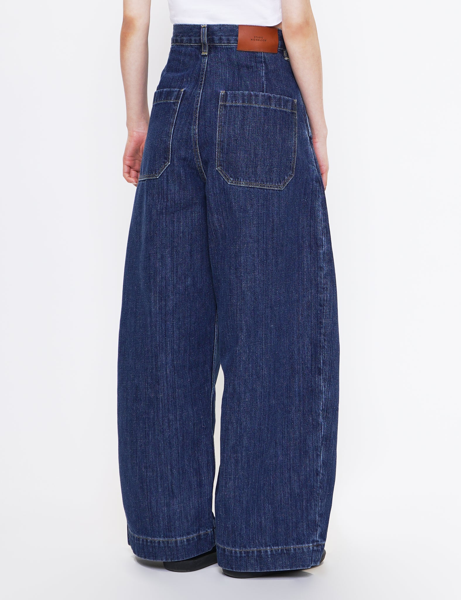 STUDIO NICHOLSON INDIGO WASHED SINGLE PLEAT DENIM PUCH PANTS